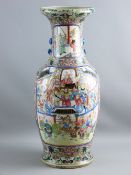 A LARGE ENAMEL DECORATED ON CELADON GROUND CHINESE VASE having framed panels of dramatic scenes