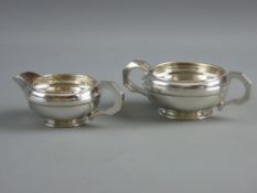 A HALLMARKED SILVER ART DECO PERIOD CREAM JUG & SUGAR BOWL having circular banding and full grip