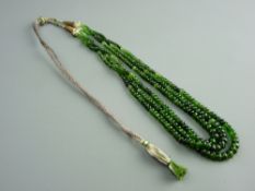 A NIGERIAN THREE STRAND CHROME TOURMALINE NECKLACE SET with sterling silver in a folding pouch