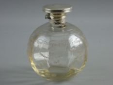 A SILVER TOPPED & ETCHED GLASS PERFUME BOTTLE, the hinged circular lid with interior glass stopper