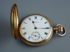 A NINE CARAT GOLD WALTHAM FULL HUNTER POCKET WATCH, having a white enamel dial set with Roman