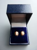 A PAIR OF UNMARKED YELLOW METAL OVAL CAMEO EARRINGS