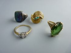 AN EIGHTEEN CARAT GOLD CROSSOVER DRESS RING with three tiny blue stones, 8 grms, a nine carat gold