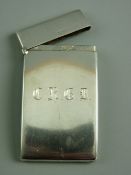 A HALLMARKED SILVER CALLING CARD CASE by Goldsmiths Company, the slightly curved case with hinged
