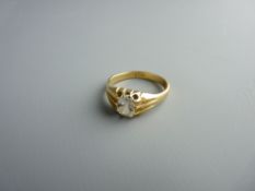 AN EIGHTEEN CARAT GOLD & DIAMOND SOLITAIRE RING, the semi-rectangular stone in a wide shouldered