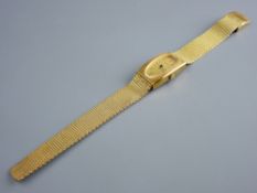 A YELLOW METAL ENCASED OBLONG DIAL BUREN DRESS WATCH with incorporated bracelet