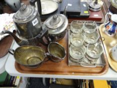 A four-piece electroplate tea service together with an EPNS Arabian-style tea drinking set