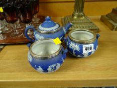 A blue Wedgwood Jasperware three-piece tea service each item with silver rim