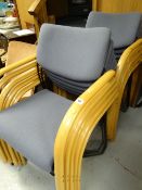 Ten stacking conference-style chairs