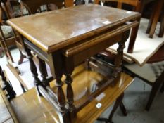 A nest of two oak coffee tables