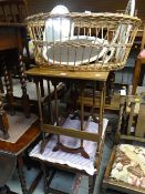 A pair of delicate coffee tables together with an oak coffee table and a wicker basket with