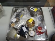 A tin tray of items including two glass paperweights, a silver ladies' fob watch and small items
