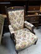 A good vintage carved elbow chair with nice contemporaneous floral upholstery