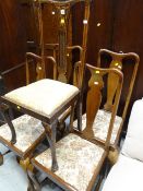 A set of four splat back vintage chairs and another