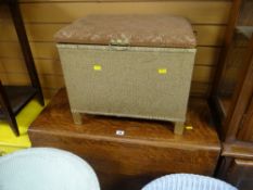 An oak drop leaf kitchen table together with a linen stool