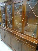 A reproduction bookcase-cupboard