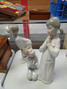 Two Lladro night gowned figures, one being a boy and girl together