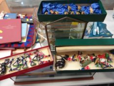 Quantity of painted metal military figures with display cases