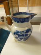 An early nineteenth century willow patterned creamware jug