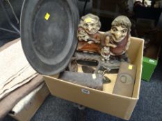 A pewter charger and a pair of painted cast metal Punch & Judy door stops etc