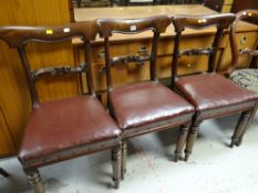 A set of three antique drawing room chairs with leatherette covering