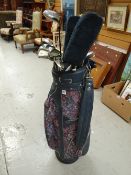 Set of Titleist oversize golf clubs together with Rhythm by Cougar and other clubs (15 in total) in