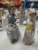 Two Lladro figures of girls in form of a Spanish dancer and the other with long medieval dress