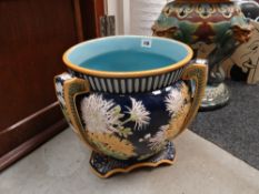 A George Jones Majolica pottery tri-handled planter (damage)
