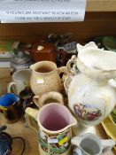 A quantity of pottery jugs, vases etc