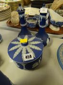 A pair of blue Wedgwood Jasperware table oil bottles and a covered jar
