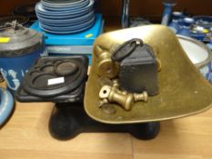 A set of old brass and iron scales with weights