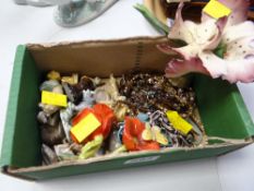 A green Beswick cardboard box with jewellery contents and Wade Whimsies