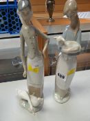 A pair of Lladro figurines of farming girls - one with geese and one with small lamb in her arms