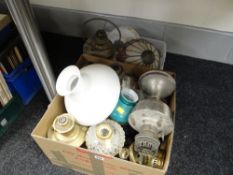 A quantity of oil lamps and associated items
