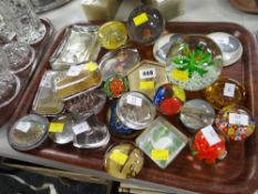 A collection of vintage glass paperweights, many of a tourism nature