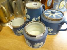 Four dark blue Wedgwood Jasperware items with silver rims