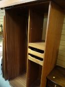 A teak wardrobe, a loom-style chair, magazine rack, half moon table, Black & Decker strimmer etc (