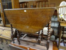 A vintage drop leaf barley-twist gate legged table