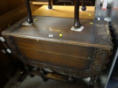 A vintage carved and shaped-top barley-twist gate legged table