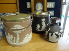 Two items of black Wedgwood Jasperware with EPNS lid and handle, similar decanter with silver collar