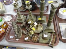 A parcel of mixed brassware including a pair of Corinthian candle holders, a pair of Arabesque