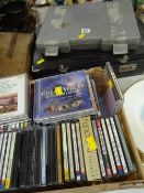 A cased kitchen knife set together with a cased set of cutlery and a collection of classical CDs