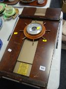 A wheel-barometer and a vintage John Corby trouser press