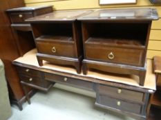An extensive suite of Stag Minstrel furniture including two good chests of drawers, two wardrobes,