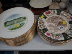A collection of Masons Christmas plates and a collection of Wedgwood stately home pictorial plates