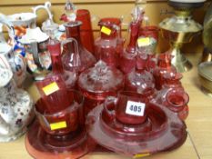 A good collection of antique cranberry glass including decanters etc
