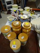 Four Portmeirion Pomona canisters and two Totem canisters together with various Staffordshire jugs