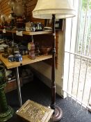 A standard lamp and shade and a coal box with relief decoration