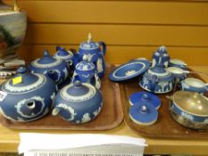 A quantity of blue Wedgwood Jasperware teapots and other items
