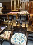 A pair of barley-twist and rosette carved vintage chairs and another together with a delicate